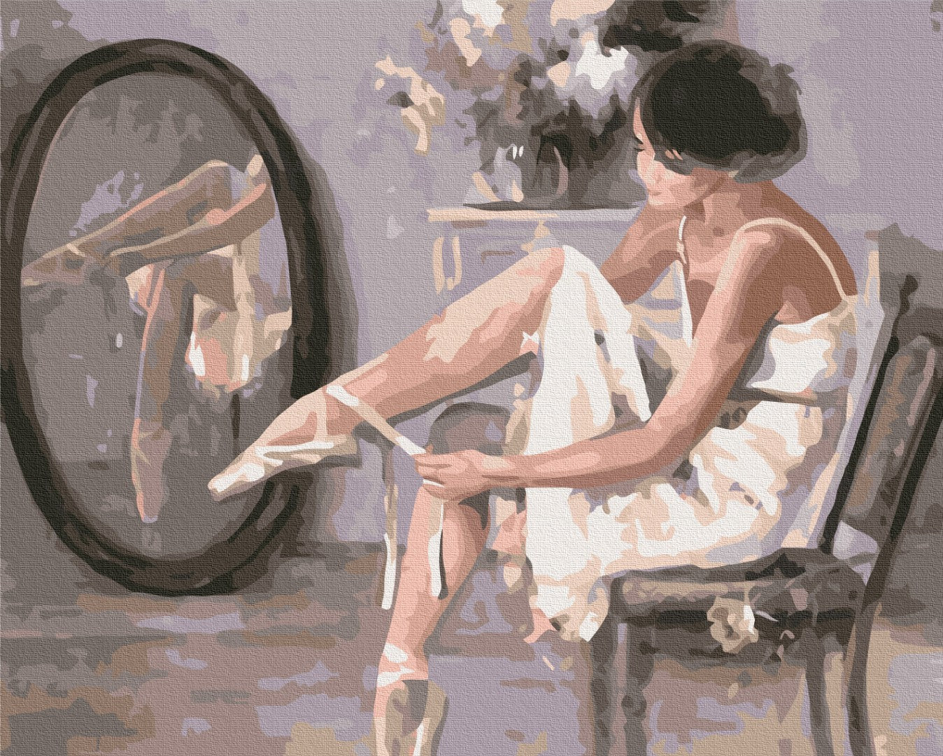 Ballerina im Ankleidezimmer bindet die Bänder ihres Spitzenschuhs vor dem Spiegel