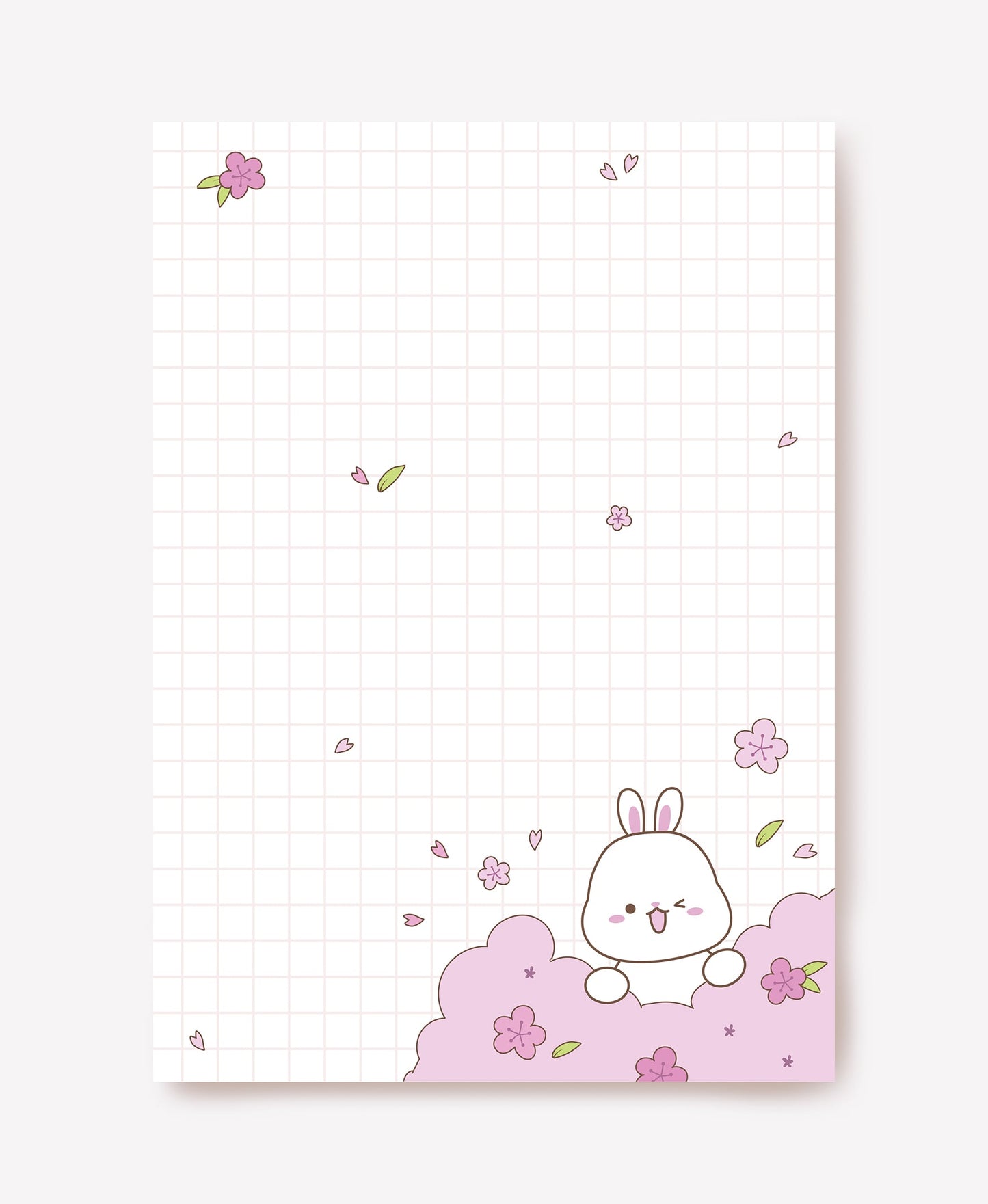 Winking white bunny among pink cherry blossoms on pale pink grid writing paper