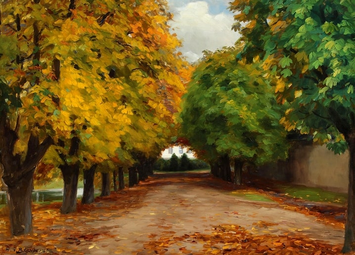 Golden chestnut avenue leading to a distant manor in autumn
