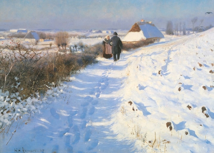 Man and woman walking away down a snowy path toward a thatched farmhouse