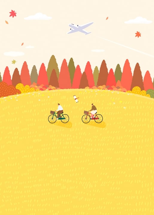 Two cyclists and a dog crossing a golden field before a colorful autumn forest