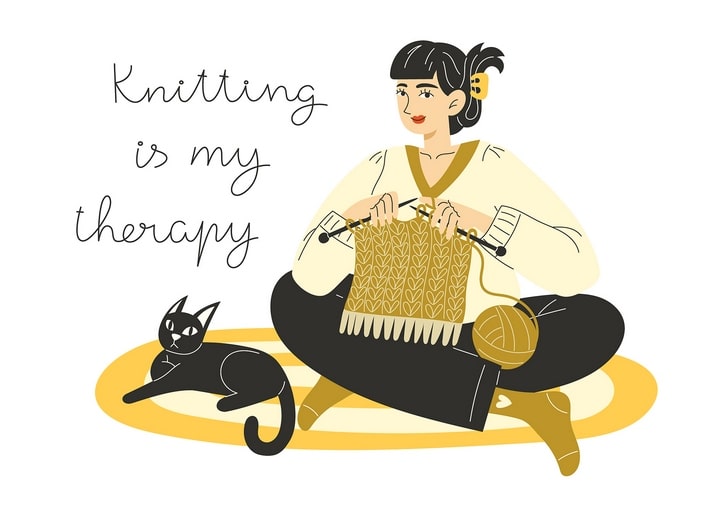 Illustration of a woman knitting with a black cat curled beside her, "Knitting is my therapy"
