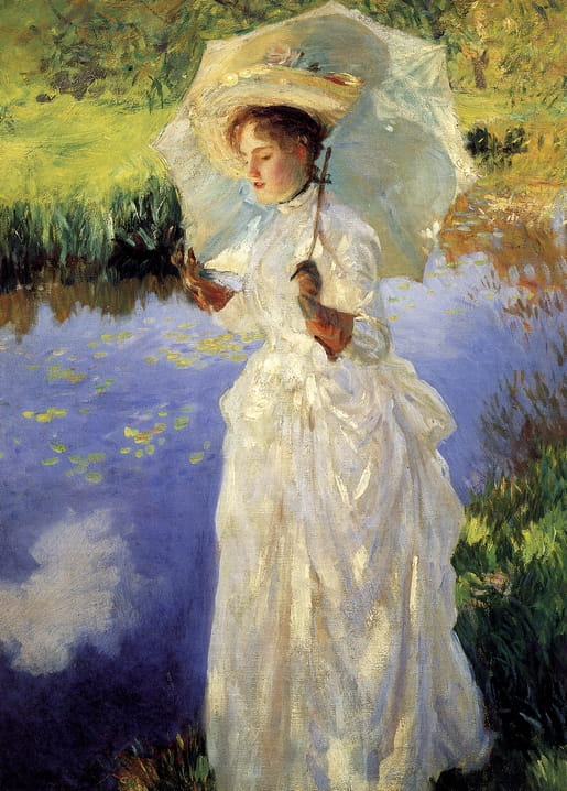 Woman in a white dress with a parasol standing by a pond with water lilies