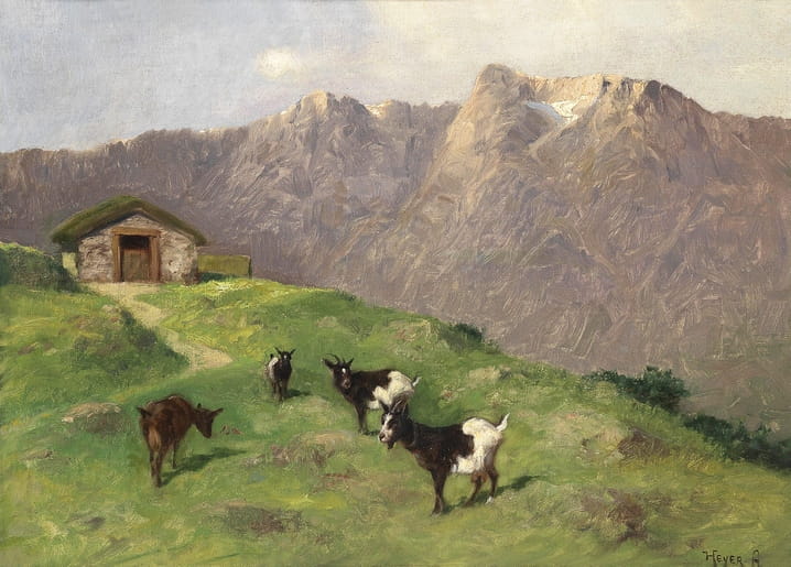 Herd of mountain goats grazing below a stone hut and snowy alpine peaks