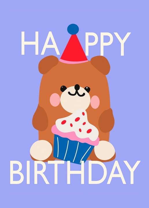 Brown teddy bear in a party hat holding a frosted cupcake on lilac background