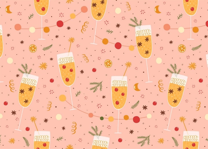 Champagnergläser, Konfetti-Girlanden, Orangenscheiben und Rosmarin auf Rosa