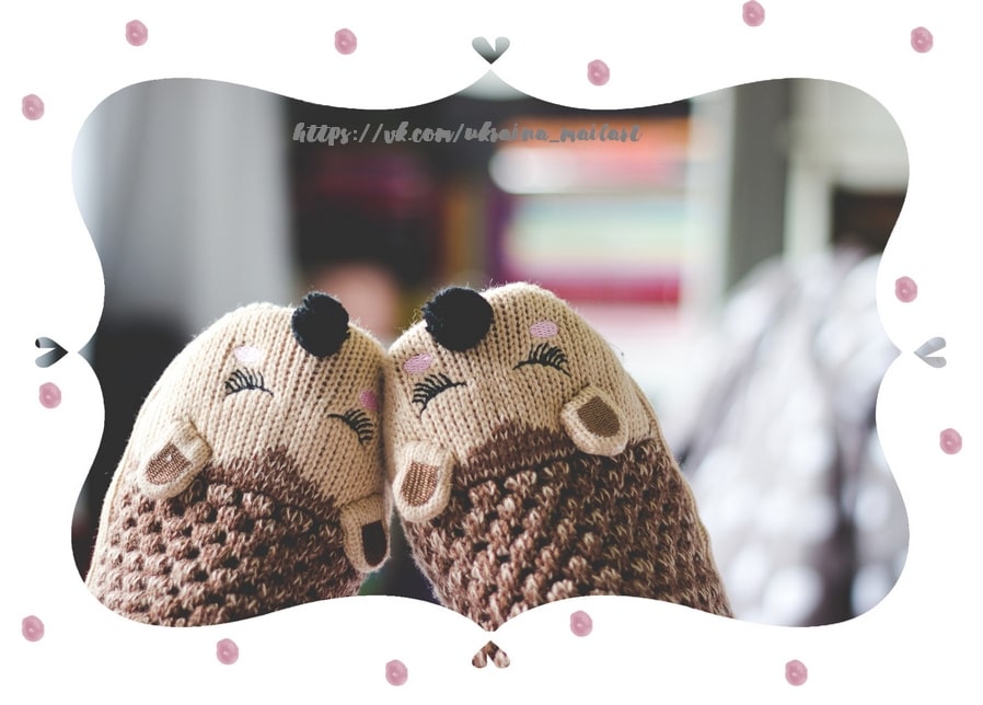 Two knitted hedgehog toys resting cheek to cheek in close-up