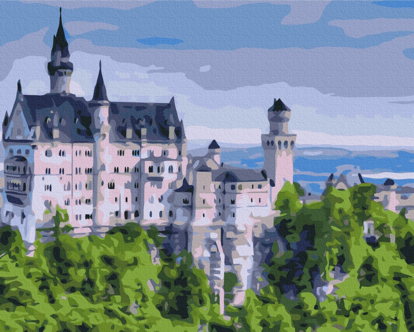 Neuschwanstein Castle's towers rising above a wall of summer green trees