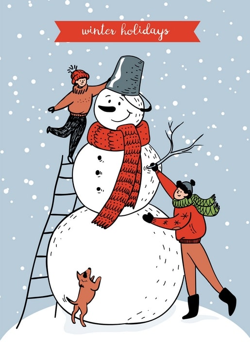 Two kids in winter hats build a snowman with a bucket hat and red scarf while a small dog jumps up