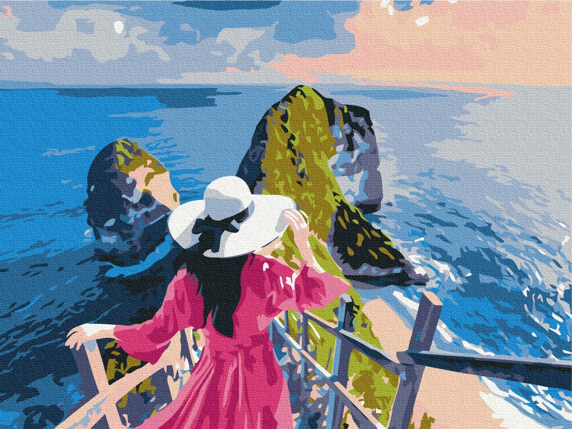 Woman in pink dress and sunhat watching sea stacks from a railing at sunset, paint-by-numbers art