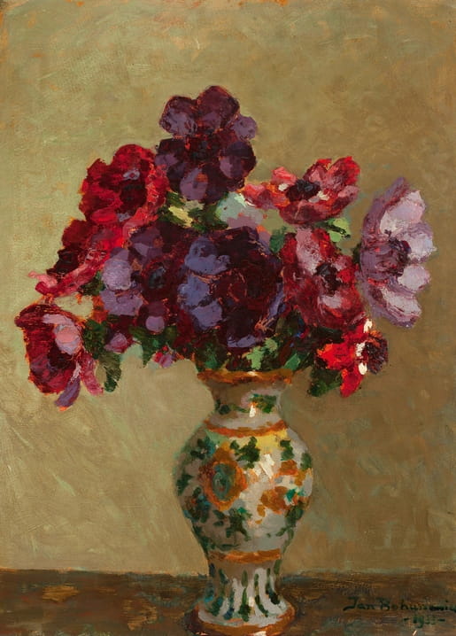 Still life painting of deep red and violet anemones in a green and gold patterned ceramic vase, signed Jan Bohuszewicz.