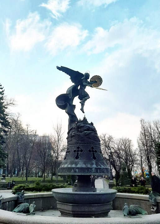 Bronze statue of Archangel Michael with sword and shield atop a bell fountain, Volodymyr Hill Park