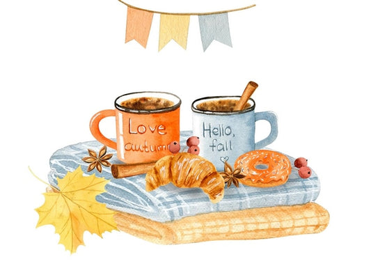 Два кухлі з написами Love autumn і Hello fall поруч із круасаном і пончиком на пледі