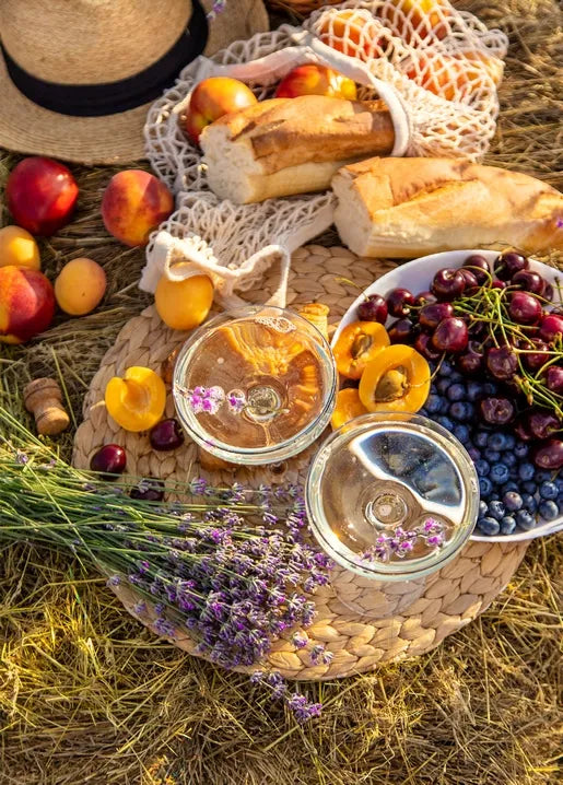 Autumn harvest picnic postcard with peaches, plums, cherries, blueberries, bread and lavender