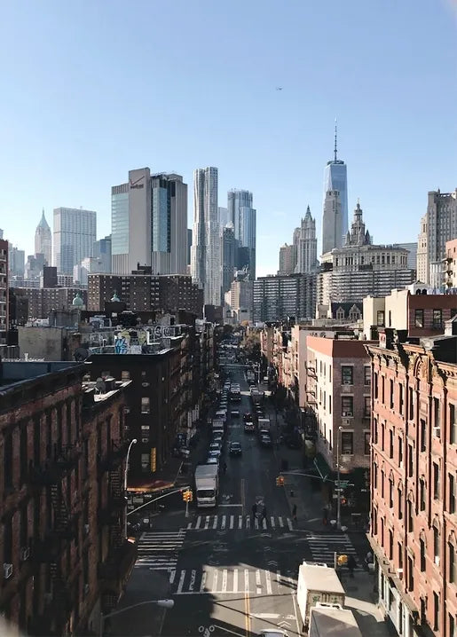 New York City photo postcard showing a street view toward One World Trade Center in Lower Manhattan