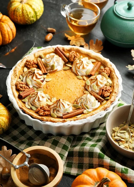 Autumn food postcard featuring pumpkin pie with toasted meringue, walnuts and cinnamon