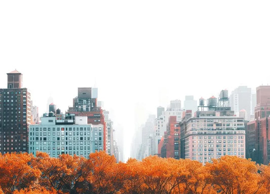 New York City photo postcard showing the Manhattan skyline beyond bright orange autumn trees
