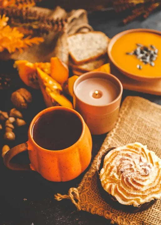 Autumn photo postcard featuring pumpkin soup, coffee, candle and pastry