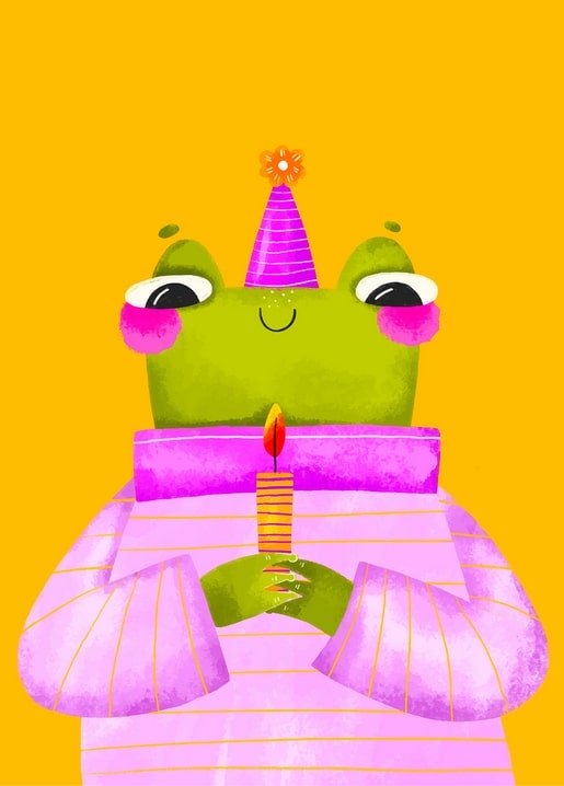 Green frog in a pink party hat holding a lit birthday candle