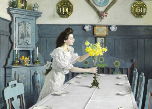 Gemälde einer Frau, die Narzissen auf einem zum Geburtstag gedeckten Tisch arrangiert