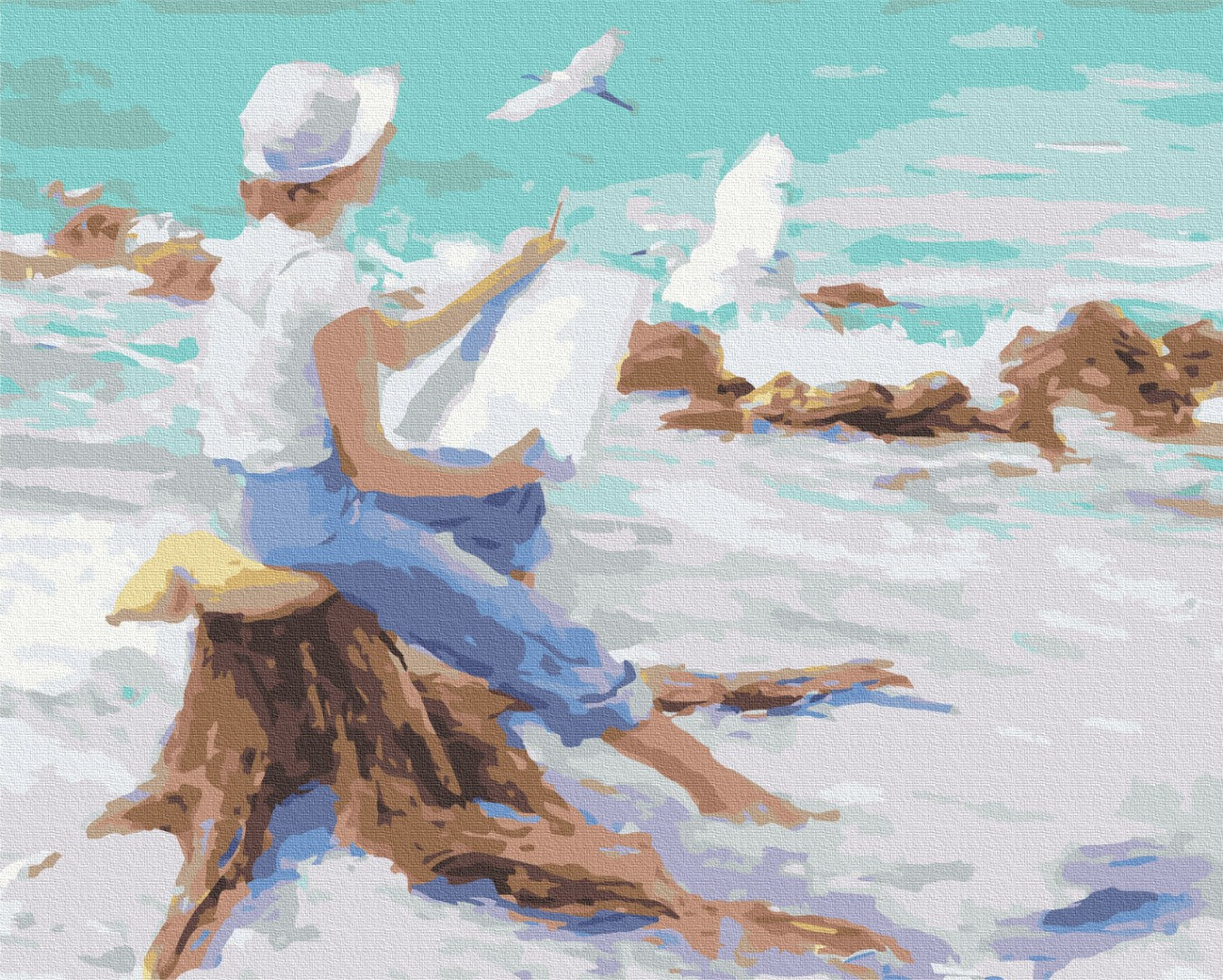 Junge mit weißem Hut malt das Meer und fliegende Möwen, sitzend auf einem Treibholzstumpf