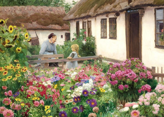 Frau spricht mit einem Mädchen über den Zaun in einem blühenden Bauerngarten