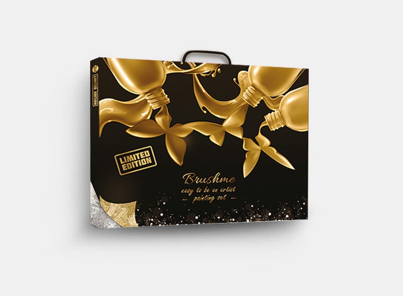 Black and gold Brushme premium gift box with paint-tube design and a carry handle