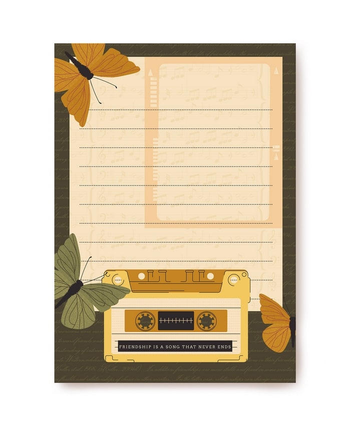 Letter paper with butterflies and a cassette tape reading “Friendship is a song that never ends”