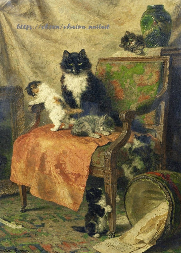 Чорна кішка-мама з кошенятами на кріслі, вкритому помаранчевим шовком