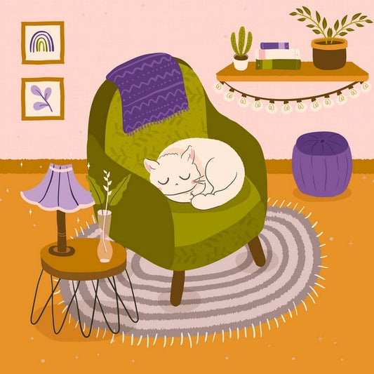White cat sleeping in a green armchair with a purple throw and plants