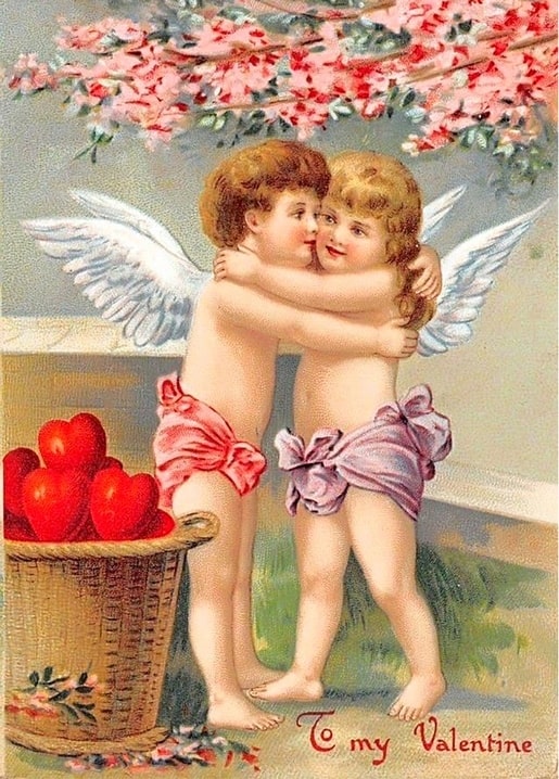 Two cherubs embracing beneath cherry blossoms beside a basket of red hearts, vintage Valentine postcard