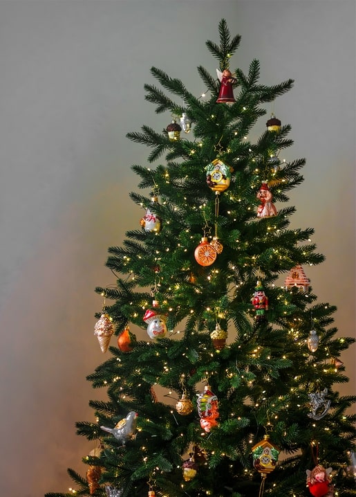 Decorated Christmas tree with fairy lights and vintage glass ornaments