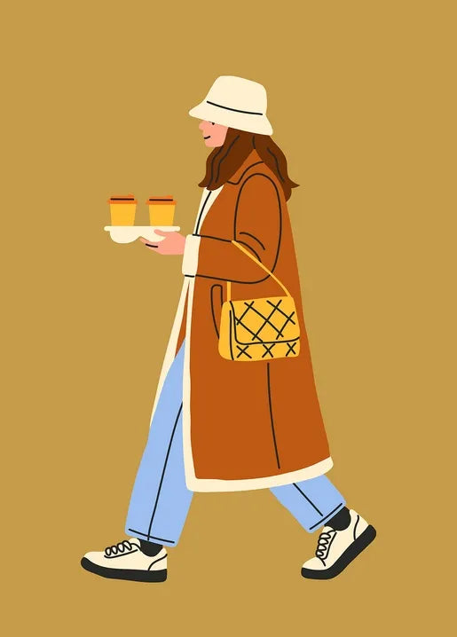 Postcard with Woman in a rust coat walking with takeaway coffee on an autumn day