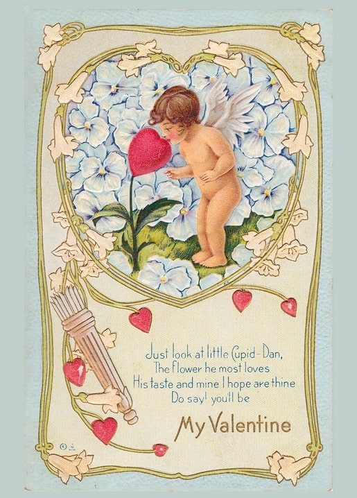 Vintage Valentine postcard of Cupid smelling a heart-shaped flower among blue pansies