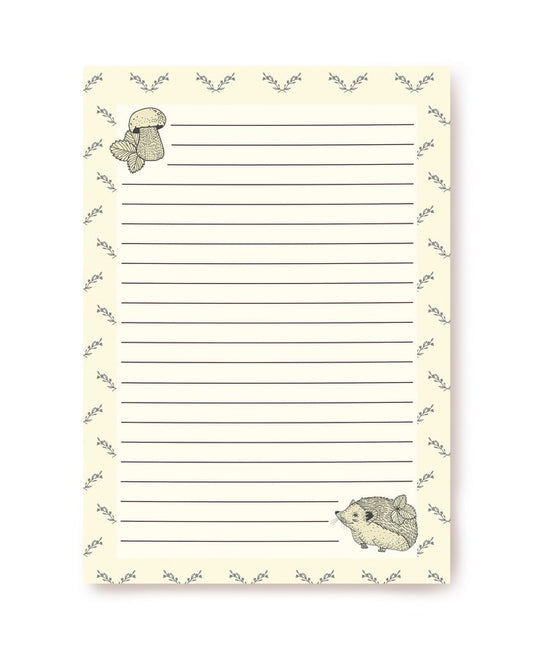 Cream writing paper with a forest border, mushroom and hedgehog illustrations