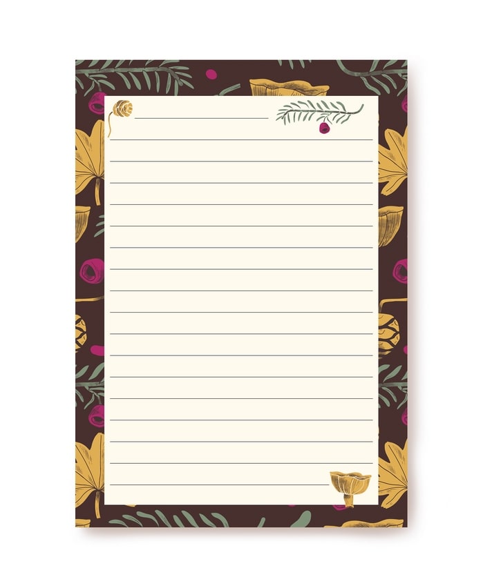 Dark maroon writing paper bordered with mushrooms, ferns and berries