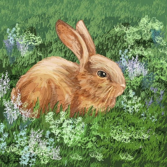 Ginger bunny sitting in grass among white and lavender wildflowers