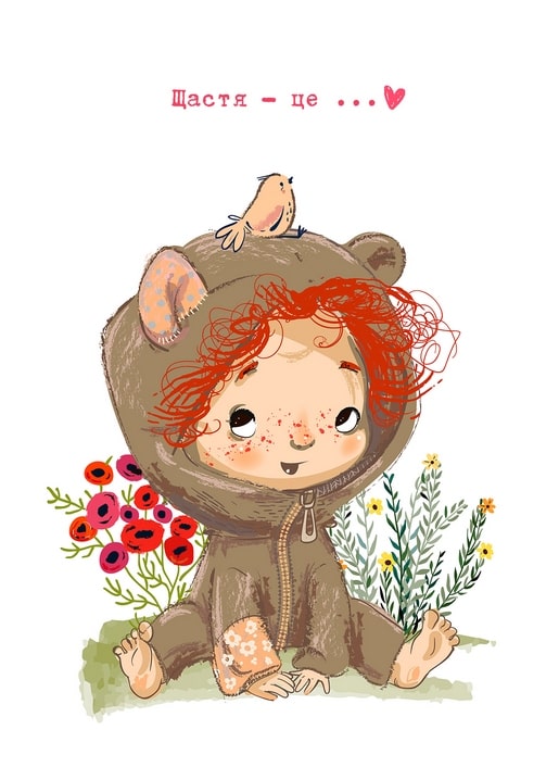 Red-haired girl in a bear costume sitting among poppies with a bird on her hood