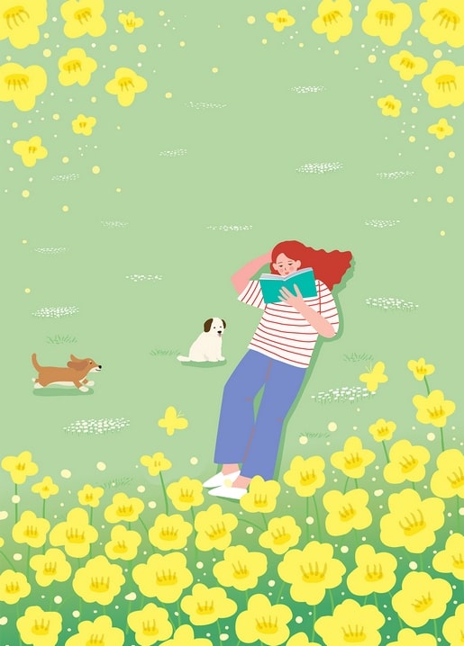 Red-haired girl reading a book in a yellow flower meadow with a dog and a puppy