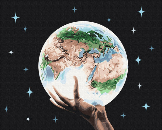 Hand holding a glowing planet Earth against a starry night sky, paint-by-numbers design