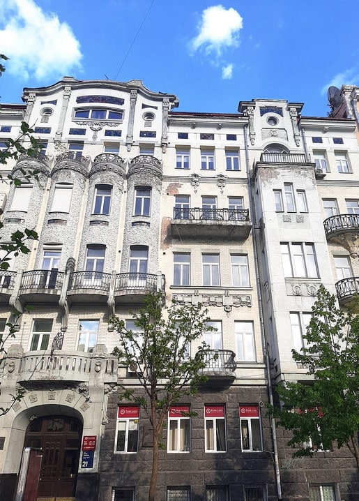 Ornate Art Nouveau facade of the Karl Baxant House with carved bay windows and iron balconies, Kyiv