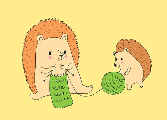 A big hedgehog knits a green scarf as a smaller hedgehog holds the ball of yarn