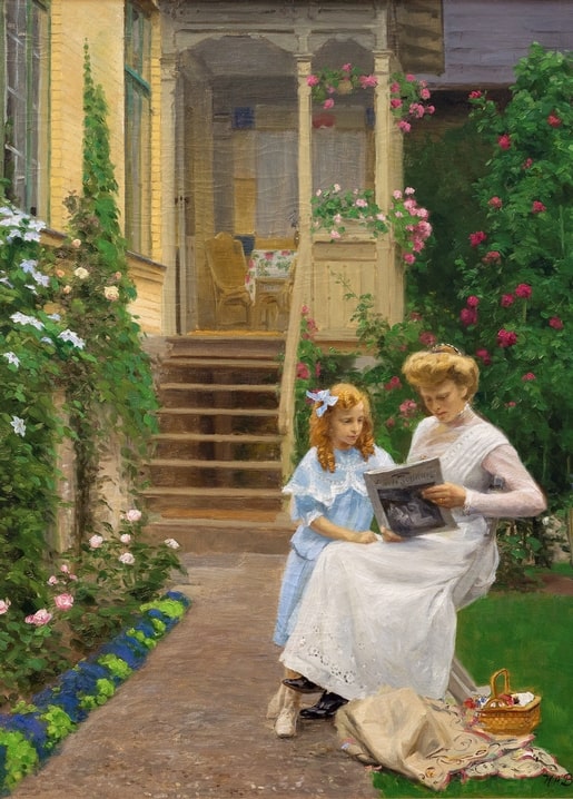 Mother in white and daughter in blue reading together on a rose-lined garden path