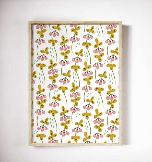 Pink berry and mustard-leaf pattern poster in a wood frame on a white wall