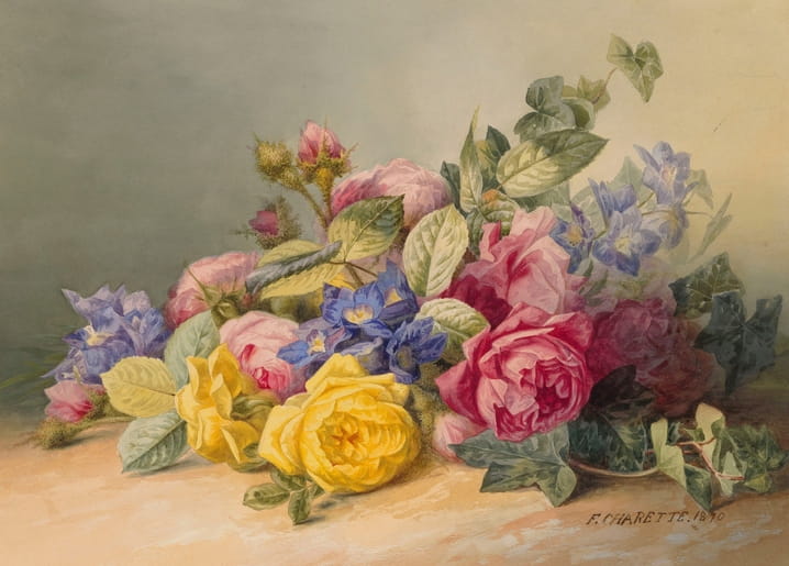 Bouquet of pink and yellow roses with blue delphiniums and trailing ivy leaves