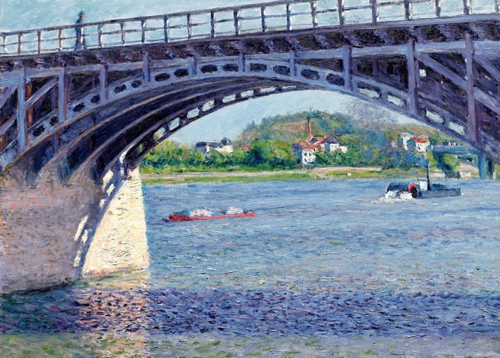 Steel bridge arching over the Seine with tugboat and barge at Argenteuil