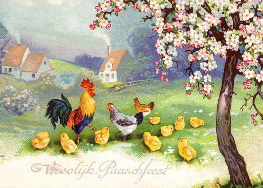 A rooster, hen and chicks under a blossoming tree with cottages in the background