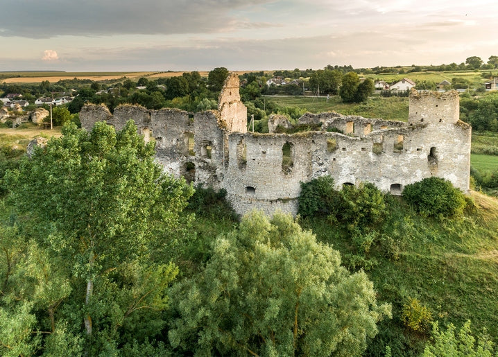Aerial view of the ruined Sidoriv Castle in Ternopil region, Ukraine, at sunset