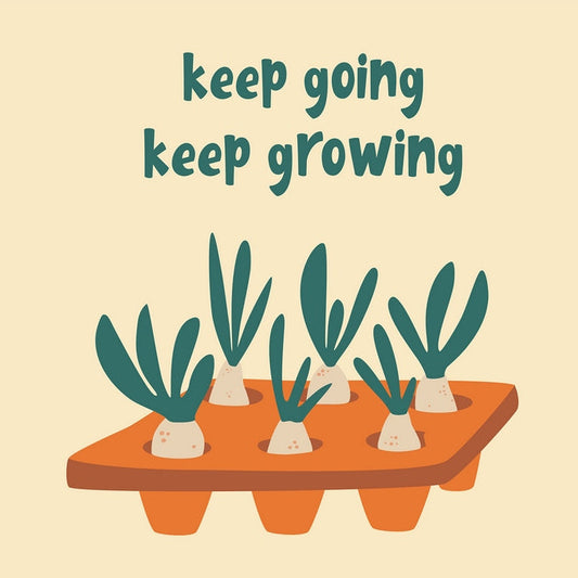 Teal onion sprouts growing in a wooden seed tray with the quote 'keep going, keep growing'