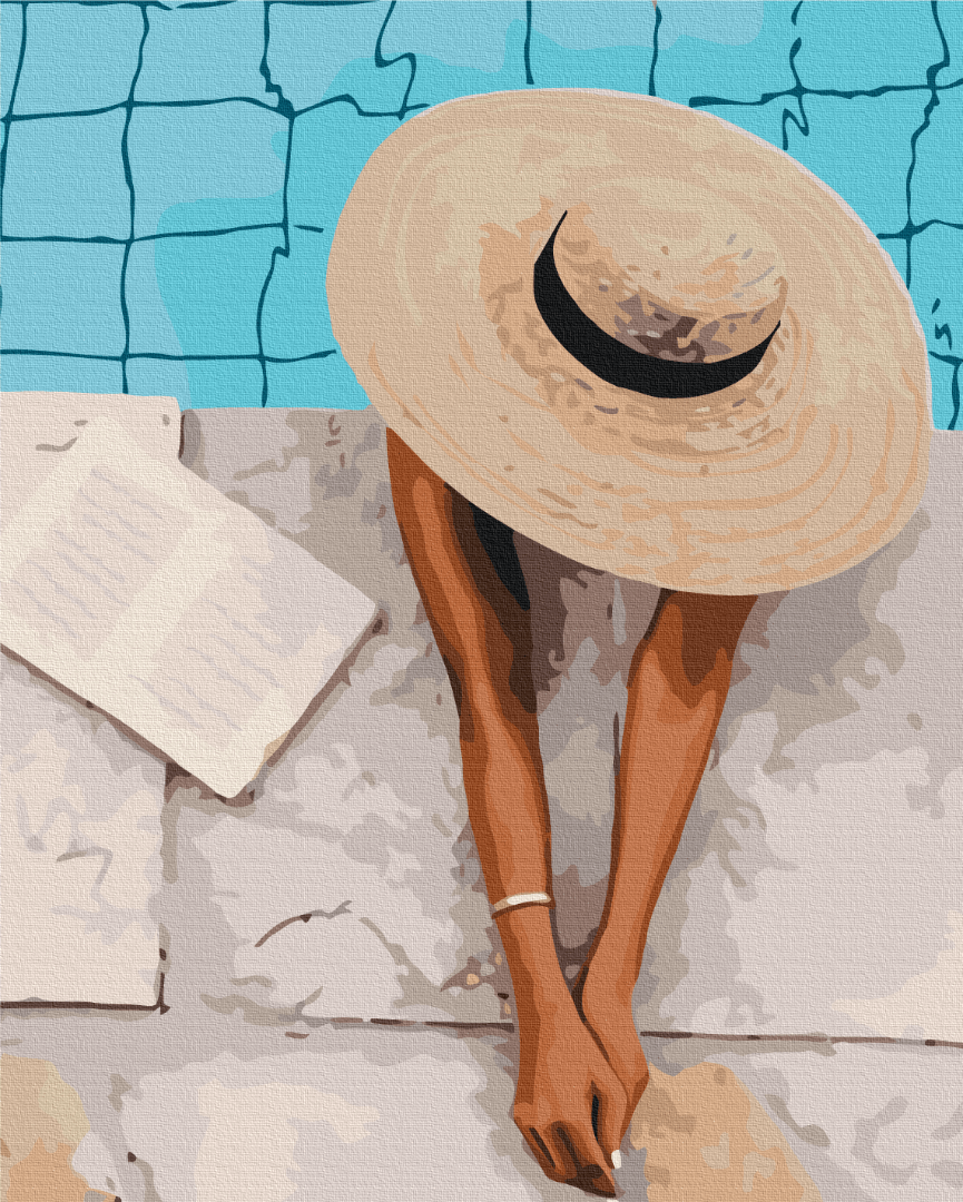 Vogelperspektive auf eine Frau mit Sonnenhut und Buch am Pool
